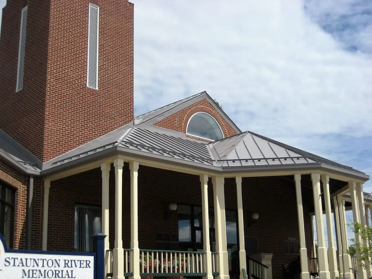 Skilled roofing craftsmen working on a residential roof in Malvern